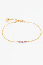 Bracelet Théa à plat, enfilage de rubis de 2 mm sur chaîne dorée