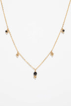 Collier Gaia spinelle à plat, pampille de spinelle surmontée d'un grelot d'or