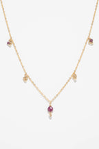 Collier Gaia rubis à plat, pampille de rubis surmontée d'un grelot d'or