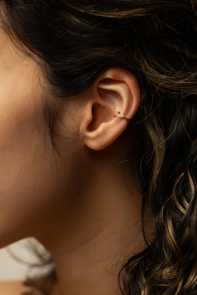 Fake cross piercing Essential